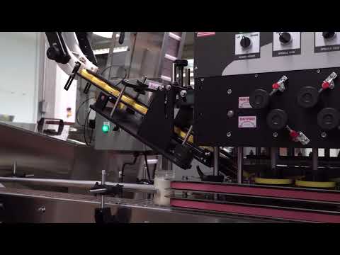 Apex Filling Systems- Automatic Capping System with Elevator Sorter